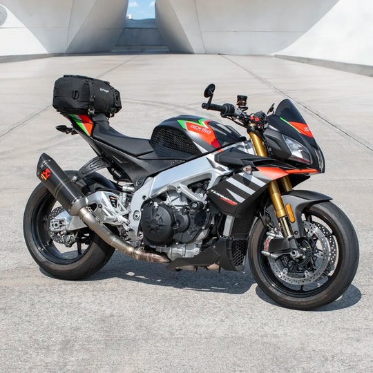 Aprilia sports bike with Kriega US-20 Drypack on concrete background