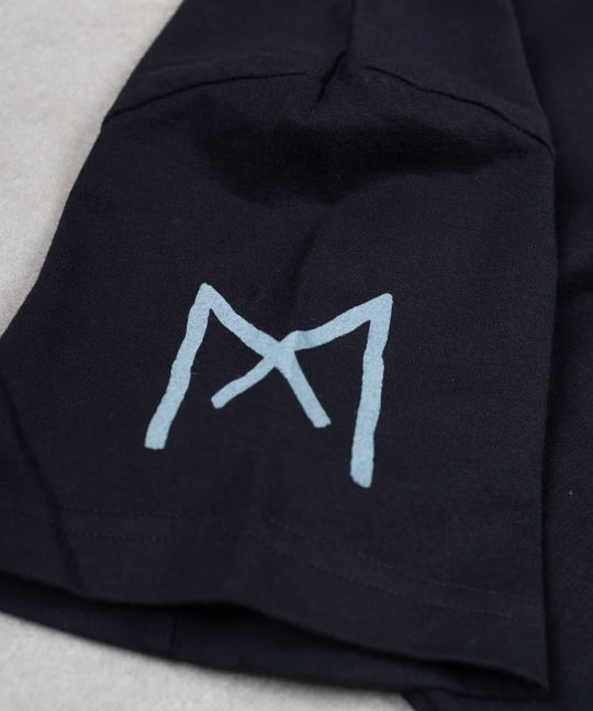 Black garment with a blue logo on a light gray background