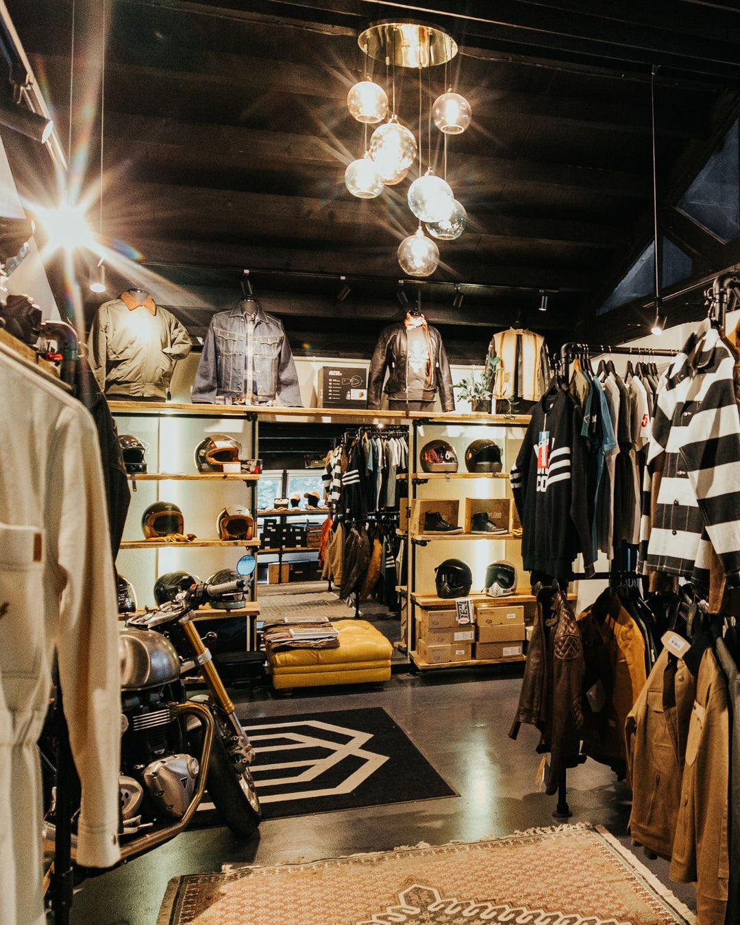 Interior of Machinehead Moto shop with motorcycle apparel and helmets on display