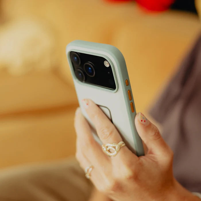 Peak Design Mobile Everyday Case for iPhone 17 Pro in Cirrus, held in hand