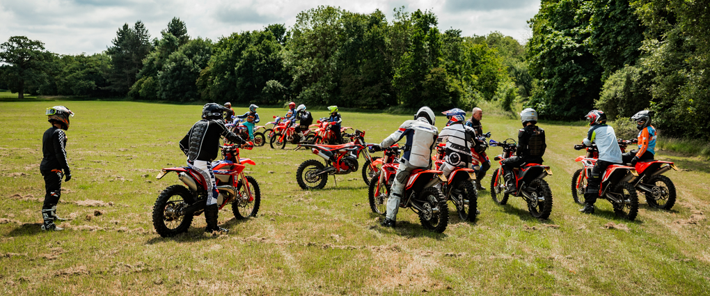 Group of off-road riders receiving coaching at Loseley Park — part of Machinehead Moto’s trail riding experience