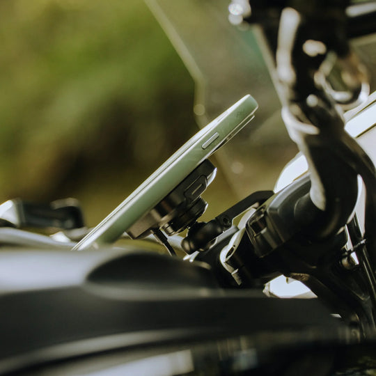 Peak Design charging motorcycle phone mount in use while riding