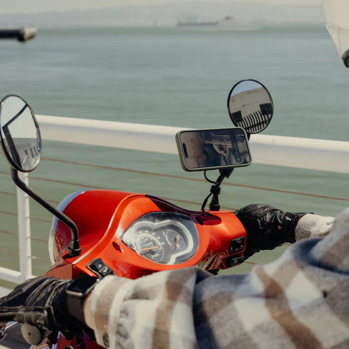 Peak Design motorcycle mirror mount with charging installed on scooter