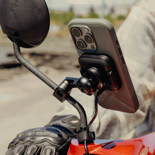 Peak Design motorcycle mirror mount with charging holding smartphone