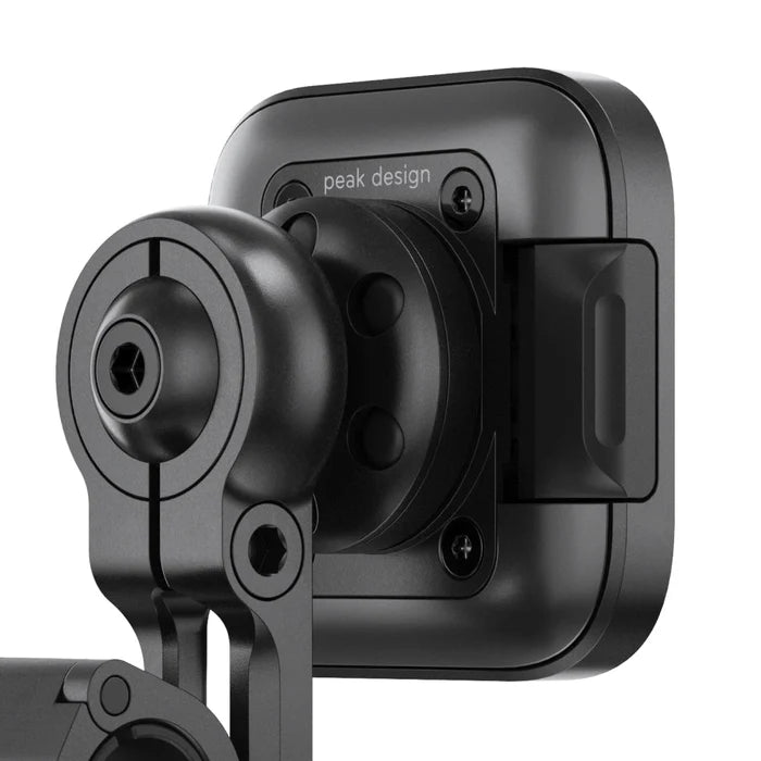 Peak Design motorcycle mirror mount with SlimLink phone attachment, close-up view