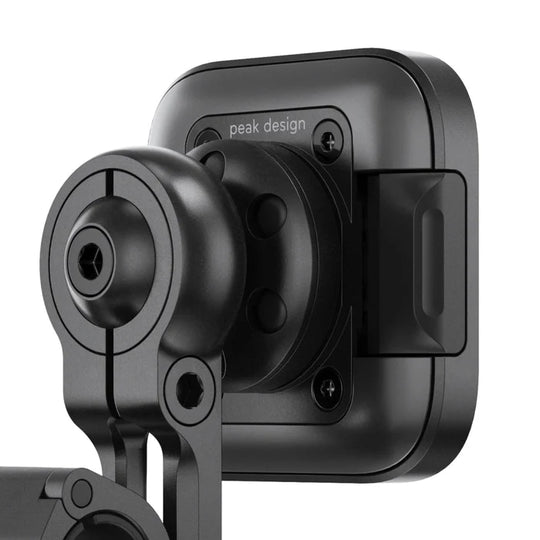 Peak Design motorcycle mirror mount with SlimLink phone attachment, close-up view