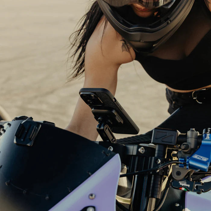 Peak Design motorcycle stem mount charging version installed – side view with rider