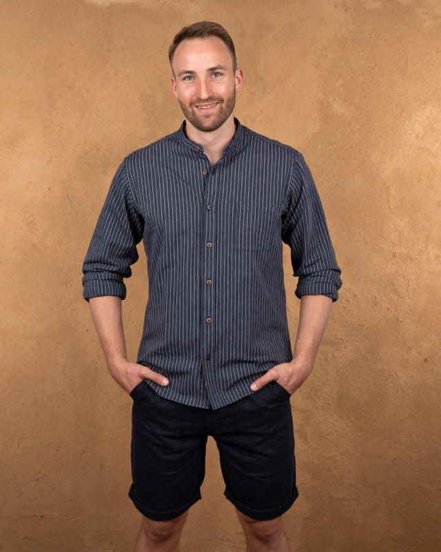 Front view of model wearing Pike Brothers 1923 Buccanoy Shirt in Beaumont Blue with hands in pockets