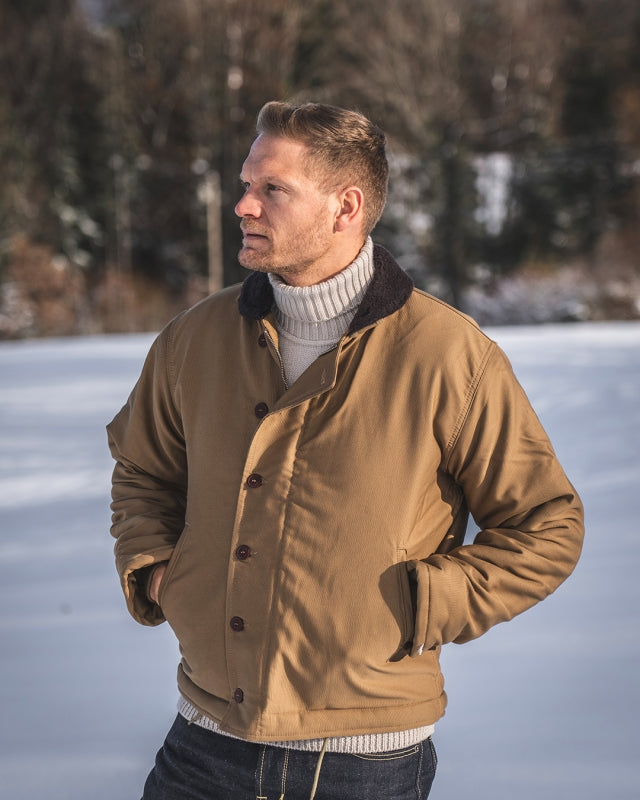 Man Wearing the Pike Brothers 1943 N1 Deck Jacket in Desert Tobacco Brown Standing Outdoors in Winter