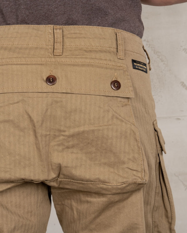 Close-up back view of Pike Brothers 1944 Monkey Pant in Olive showing pocket and Pike Brothers badge