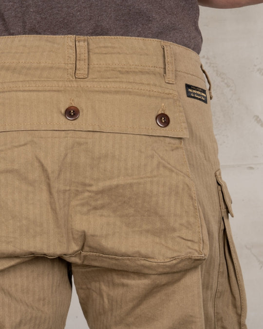 Close-up back view of Pike Brothers 1944 Monkey Pant in Olive showing pocket and Pike Brothers badge