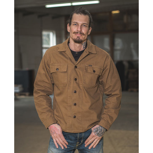 Pike Brothers 1962 OG-107 shirt brown men’s lifestyle image worn with denim in workshop setting