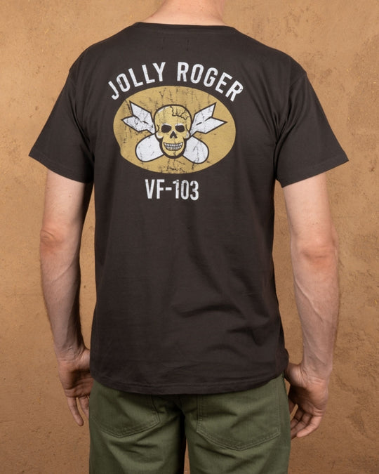 Model wearing Pike Brothers 1969 Jolly Roger Tee in Black with olive cargo pants – back view