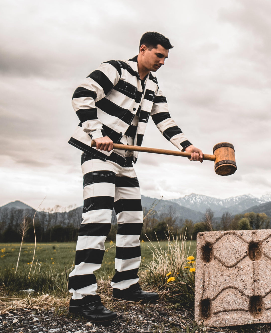 Model holding mallet wearing full Pike Brothers Alcatraz outfit – striped shirt, vest, and trousers