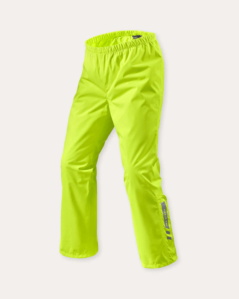 Front view of REV’IT! Acid 4 H2O rain pants in neon yellow with elastic waistband and reflective detailing