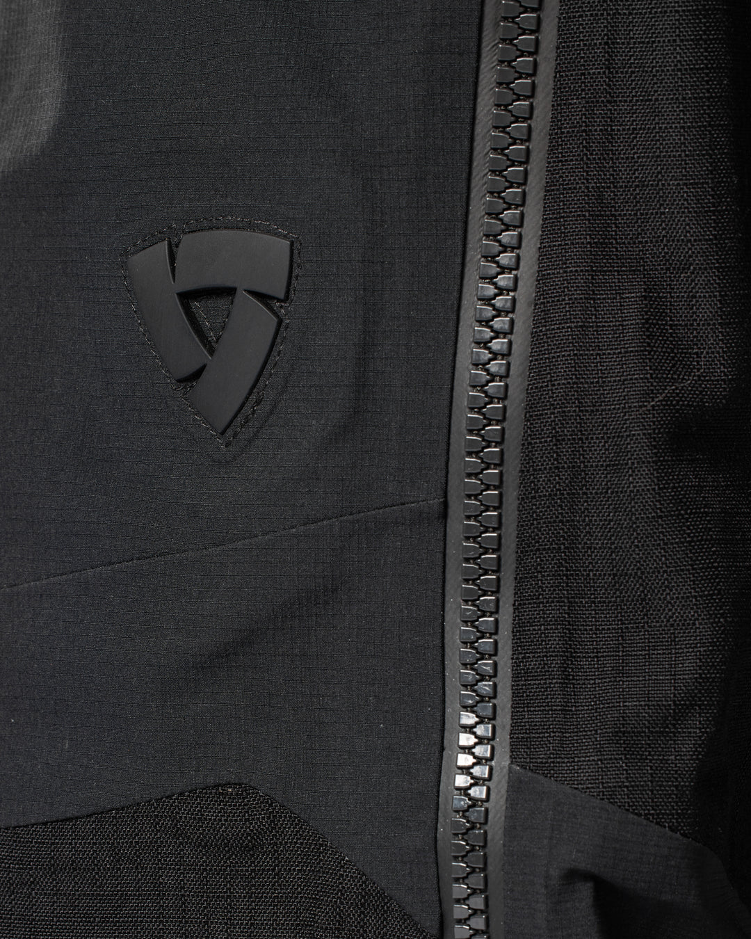 REV’IT logo and waterproof zip close-up on Component 3 H2O pants