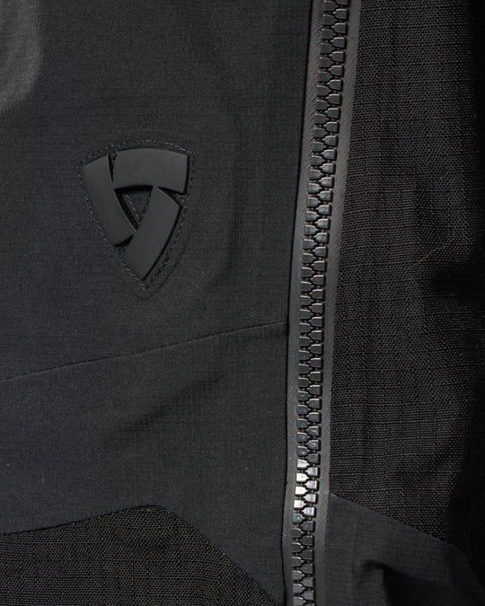 REV’IT logo and waterproof zip close-up on Component 3 H2O pants