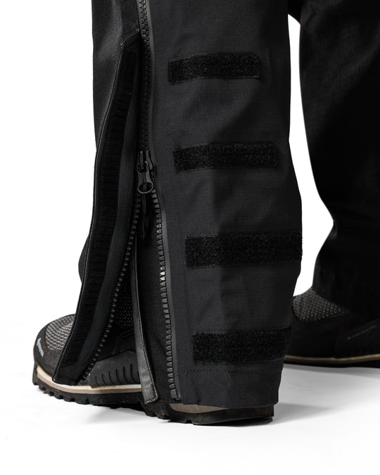 Lower-leg Velcro adjustment strap on REV’IT Component 3 H2O pants