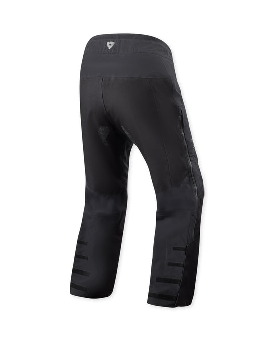 Rear view of REV’IT Component 3 H2O motorcycle pants in black being worn