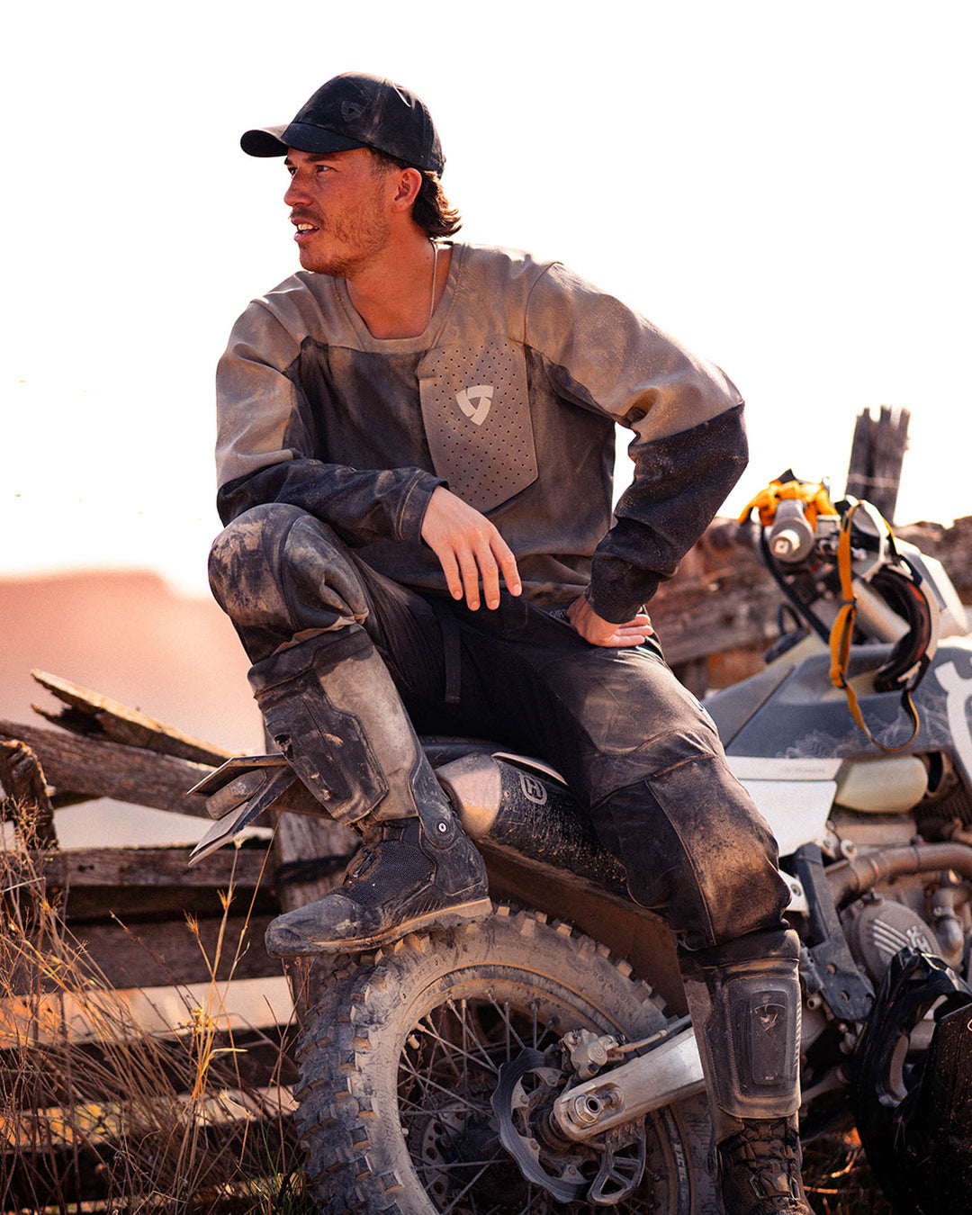 Model wearing REV’IT! Expedition GTX Motorcycle Boots while sitting on an off-road motorcycle.
