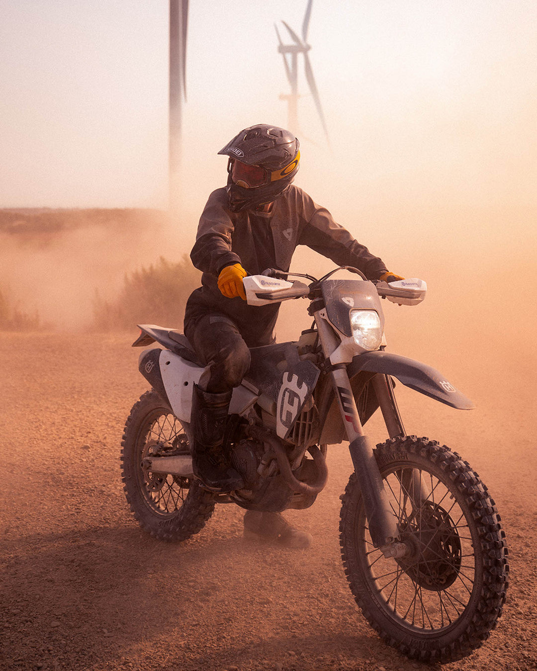 Model wearing REV’IT! Expedition GTX Motorcycle Boots while riding an off-road motorcycle.
