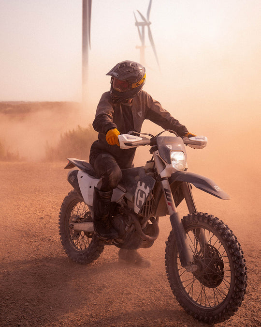 Model wearing REV’IT! Expedition GTX Motorcycle Boots while riding an off-road motorcycle.
