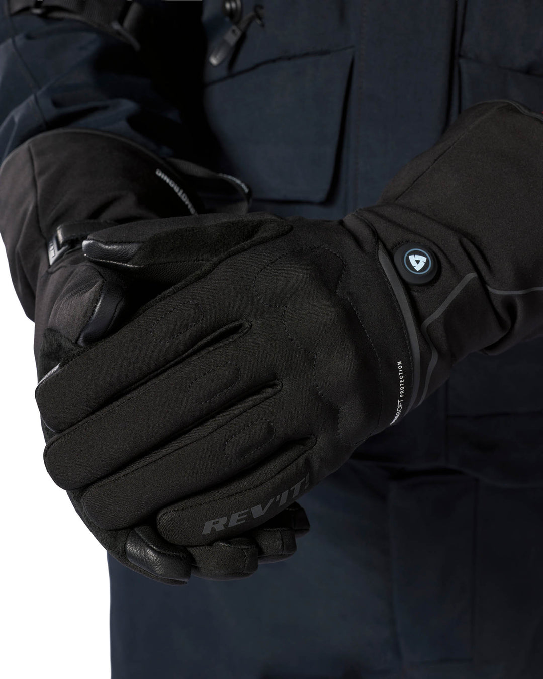 REV’IT! Freedom H2O Heated Gloves worn close-up showing heat control.
