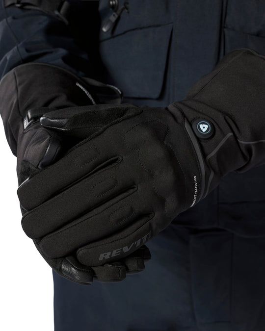 REV’IT! Freedom H2O Heated Gloves worn close-up showing heat control.
