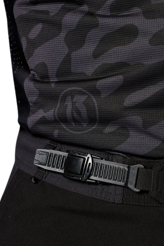 REV’IT! Lejano Motorcycle Trousers in black, close-up waist adjustment strap detail.
