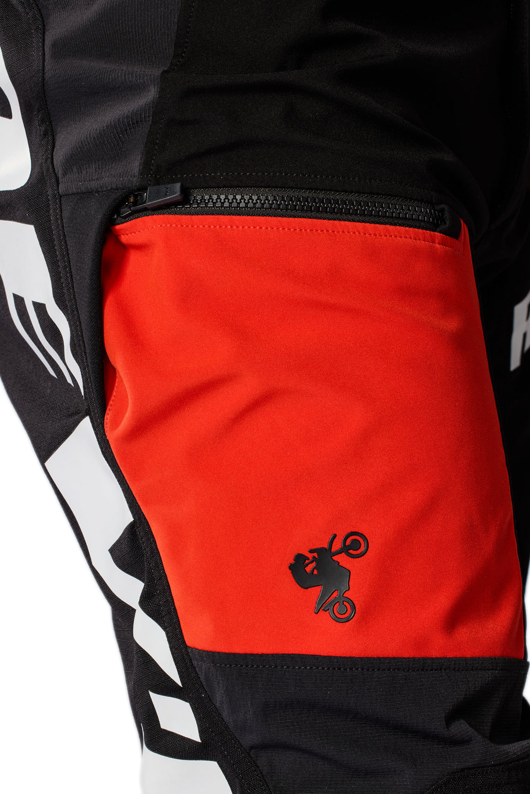 REV’IT! Lejano Motorcycle Trousers in black and red, close-up thigh pocket detail.
