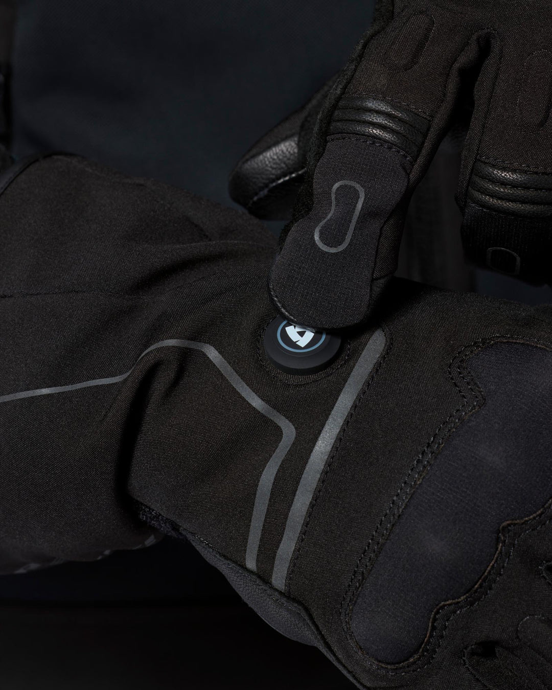 REV’IT! Liberty 2 H2O Men’s Heated Motorcycle Gloves in black, close-up heating control detail.
