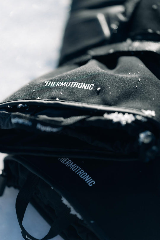 REV’IT! Liberty 2 H2O Men’s Heated Motorcycle Gloves in black, close-up Thermotronic detail.
