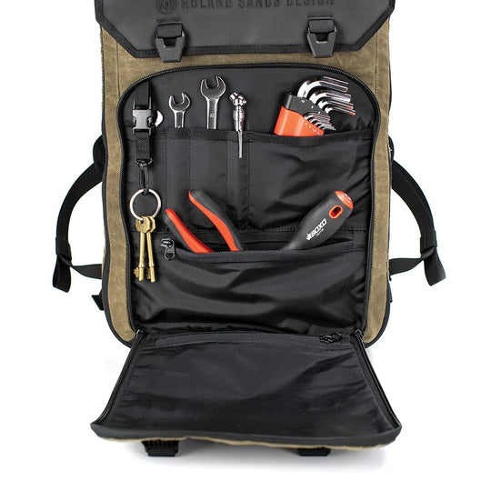 Roland Sands Design x Kriega Roam 34 Backpack open with tools stored inside on white background
