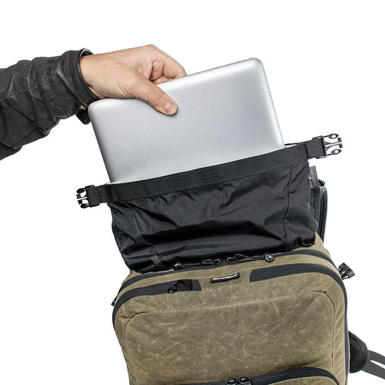 Roland Sands Design x Kriega Roam 34 Backpack with laptop being packed inside