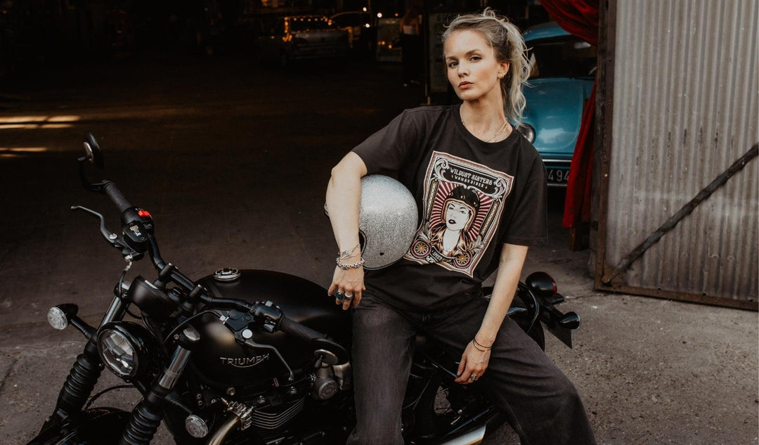 Wildust-sister-woman-rider-tee-front-model-garage