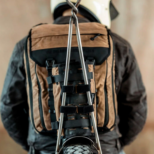 Roland Sands Design x Kriega Roam 34 Backpack in Brown carrying motorcycle tyre – Machinehead Moto
