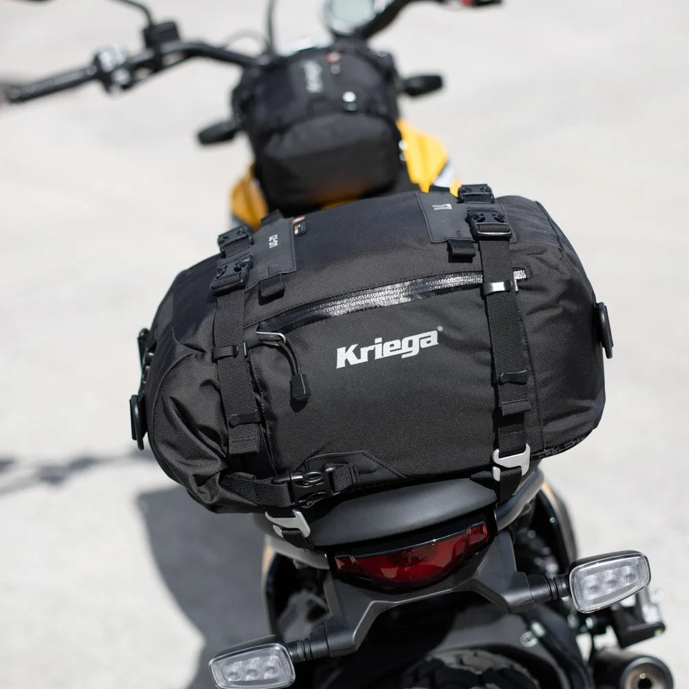 Kriega US-20 Drypack mounted on the rear seat of a yellow Ducati Scrambler motorcycle