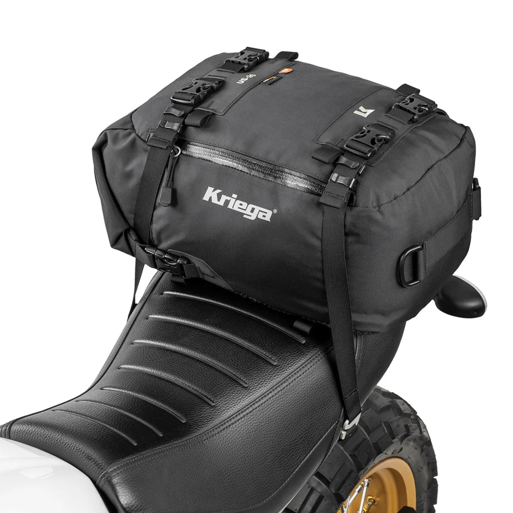 Kriega US-20 Drypack mounted on a Scrambler motorcycle seat with white background