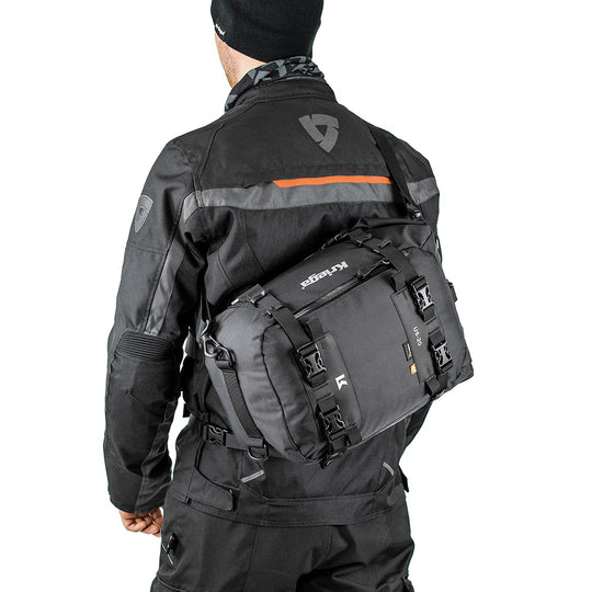 Rider wearing Kriega US-20 Drypack cross-body with Rev’it jacket