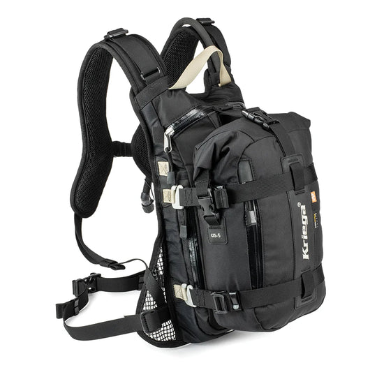 Kriega US-5 Drypack mounted on backpack harness, black with multiple straps on white background