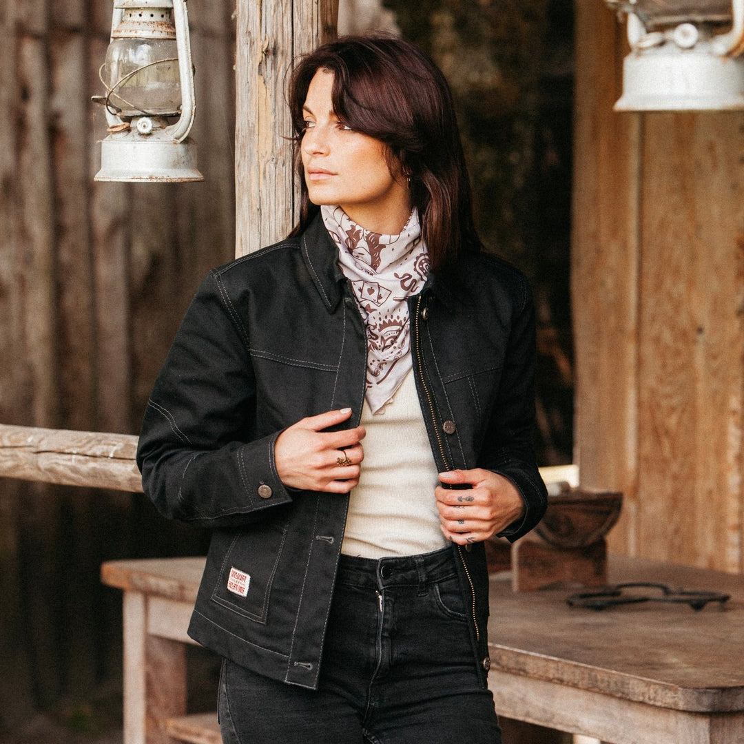 Lifestyle view — rider wearing Wildust Sisters scarf with cowgirl and paisley artwork