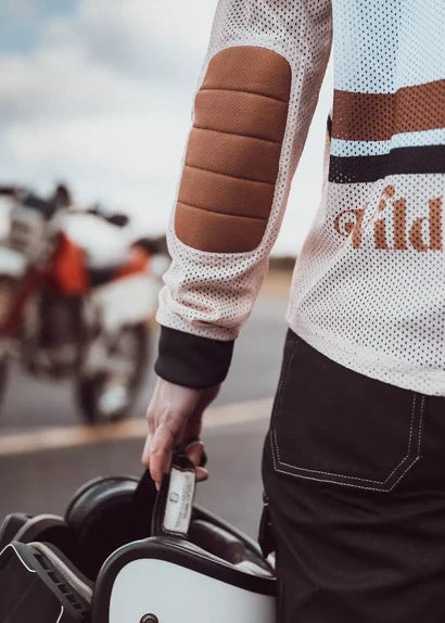 Detail view of Wildust Sisters Classic Rider Mesh Jersey Cross showing elbow panel and mesh fabric
