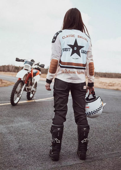 Back view of Wildust Sisters Classic Rider Mesh Jersey Cross in lifestyle riding scene