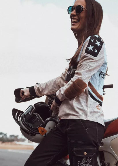 Side view of Wildust Sisters Classic Rider Mesh Jersey Cross in lifestyle riding scene