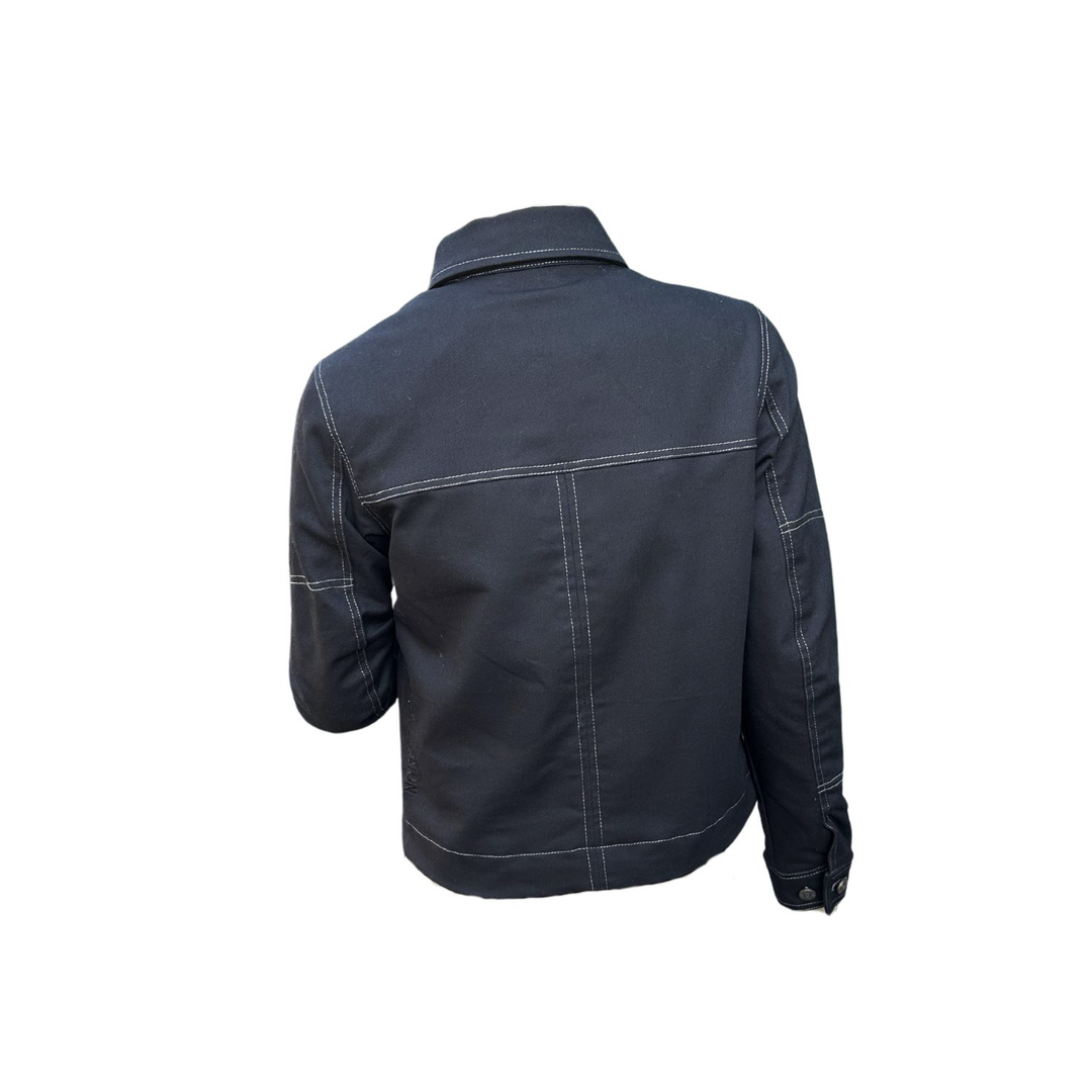 Back view of Wildust Sisters Pioneer Jacket in Black on mannequin, white background