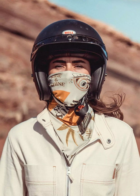 Rider wearing Ride & Shine Scarf as neck tube – khaki and ecru reversible print