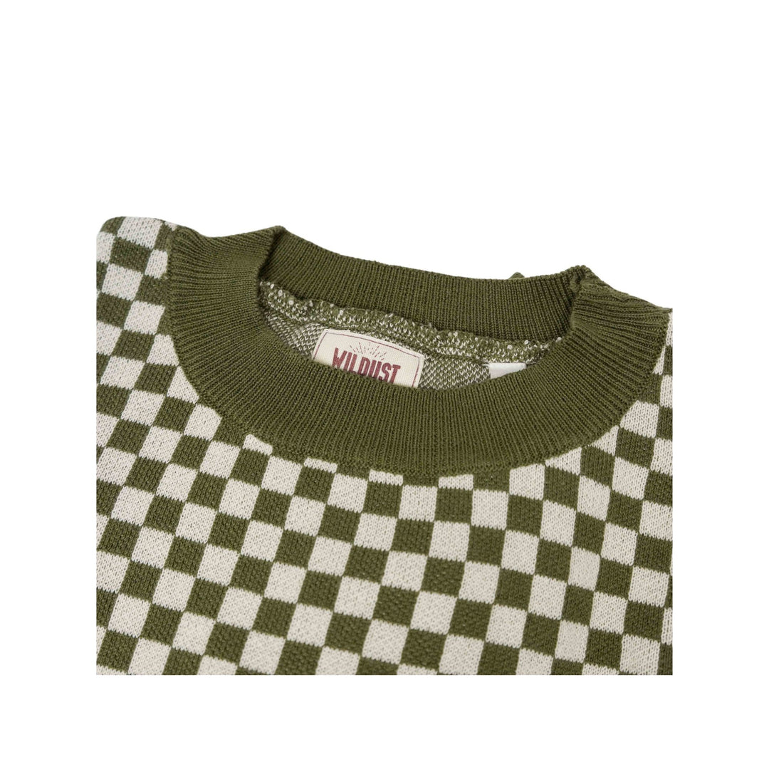 Close-up of the Wildust Sisters Vintage Racing Jumper in Khaki showing the ribbed crew neck and chequered cotton knit