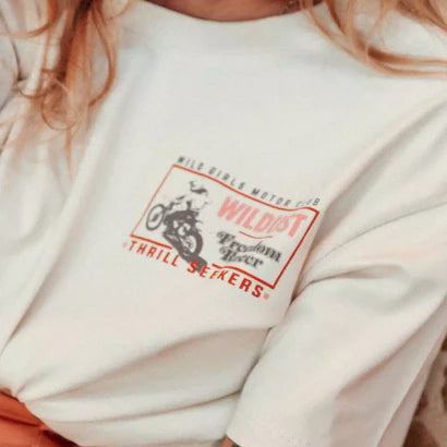 Close-up of Wildust Sisters Freedom Racer T-shirt front chest logo print.
