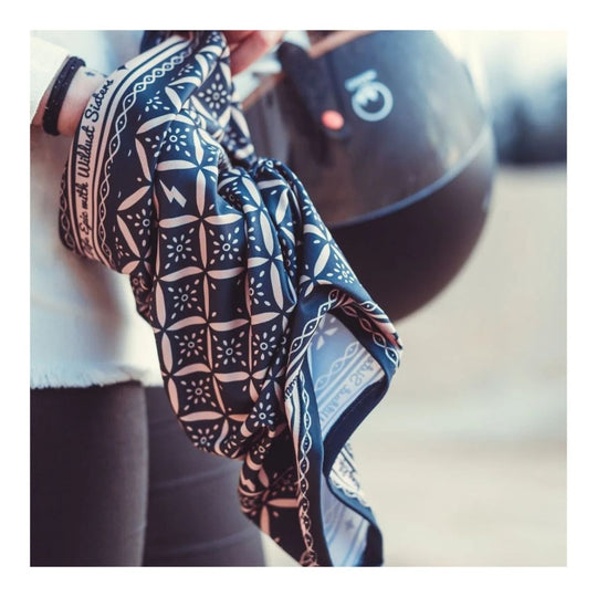 Wildust Sisters neck warmer epic black graphic print held lifestyle image