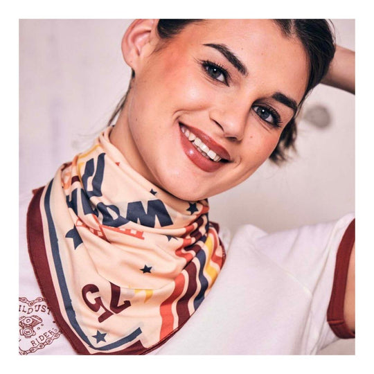 Wildust Sisters Pole Position motorcycle scarf worn around neck with retro racing print lifestyle close-up